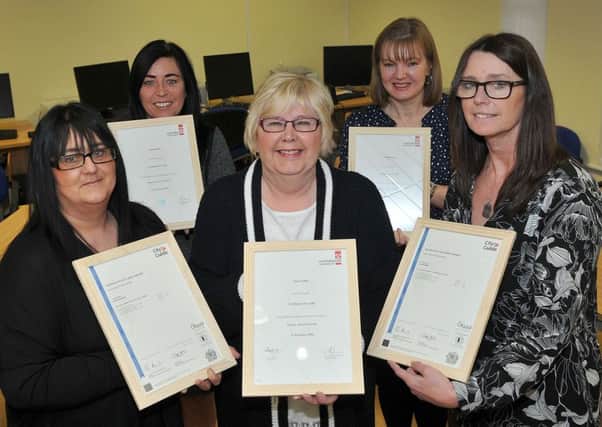 Citizens' Advice staff, from left, Julie Pennick, Ann Brown, Janet Noble, Jill Hutton and Carol Dees with their certificates.