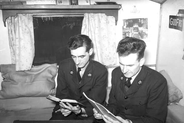 Two men taking part in a caravn Bible-reading session. Who are they?