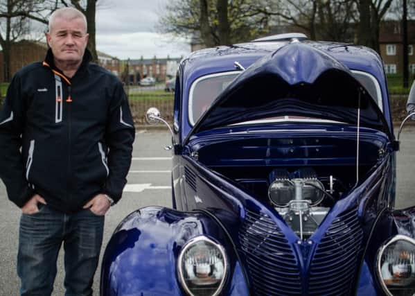 Derek Hoggarth beside a 1938 Ford Coupe at the Tesco event. Pic:  Joe Spence.