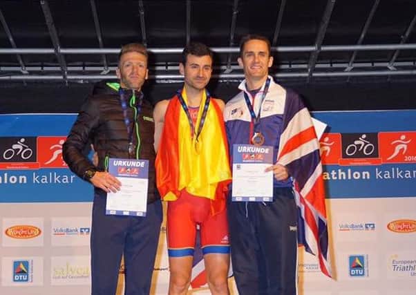 Matt Turnbull, far right, receiving his bronze medal in the European Duathlon Championships in Germany