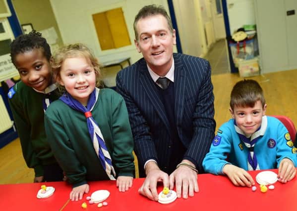 Andy Preston, chairman of Teesside Philanthropic Foundation, talks to children at the 2nd Billingham Scouts, who won Â£1,000 in the charitys last Â£20,000 Golden Giveaway.  Pic: Doug Moody.