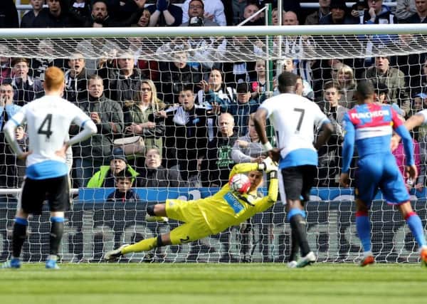 Karl Darlow saves a penalty for Newcastle United