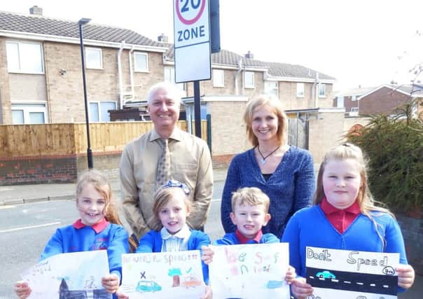 Winning pupils Amber Arnell, 8, Emily Lynn, 8, Zakk Green, 6, and Tegan Smith, 10, with Justin Goult and Alison Bloomfield, Throston Primary Schools Walk to School Co-ordinator.