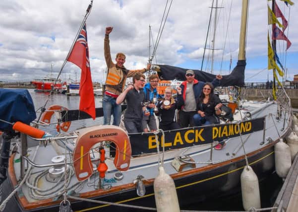 Black Diamond skipper Calvin Whitehand, second right, with his crew from the 2015 Tall Ships Races.