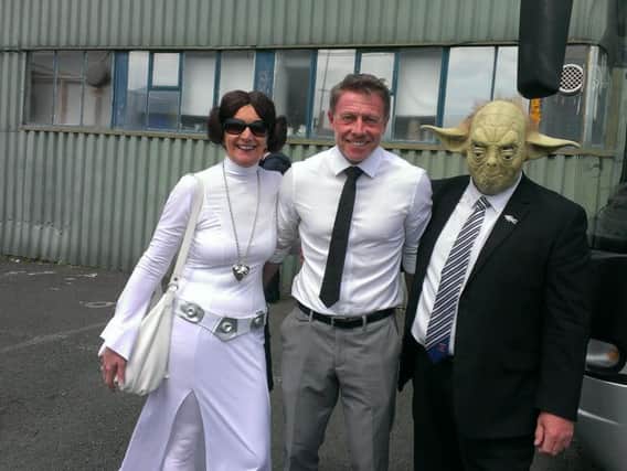 Russ Green (right) with partner Jacqui, and Pools manager Craig Hignett.