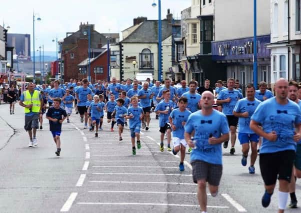 Men and boys take part in the Miles for Men event in Hartlepool in 2015.