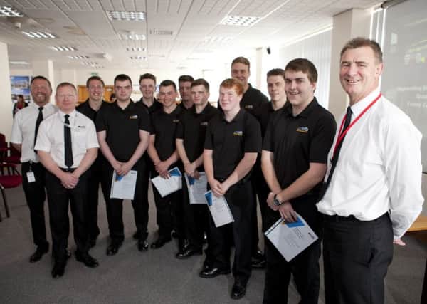 The ten trail-blazing apprentices graduating from the first part of their training with (from left in white) Barry Waller, Davey Veitch and CEO Ian Hayton of CFB Risk Management.