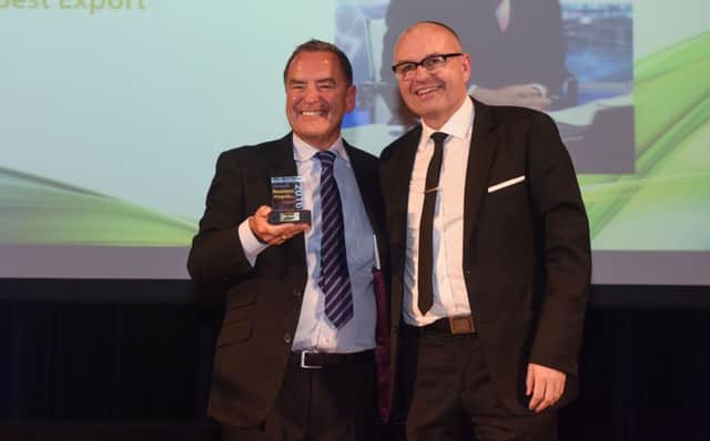 Sky Sports presenter Jeff Stelling collects his trophy at the Hartlepool Business Awards from awards co-ordinator Andrew Steel.