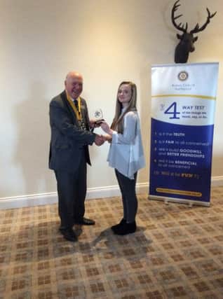 Katie Cosgrove  is presented with her trophy and cheque by President Elect, Alan Lakey