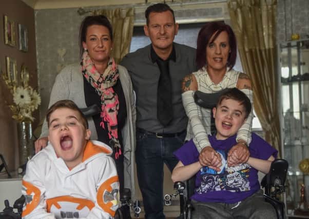 12-year-old twins Corey (left) and Charlie Merrington, of Peterlee Close, Peterlee, who were struck down with duchenne muscular dystrophy aged 4, pictured with l-r Danielle Horton, Dean Armstrong who are organising a charity event to raise funds for a family holiday and the twins mum Marie.