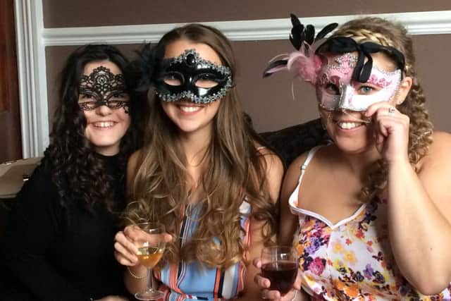 Three girls enjoying the Ellie-Mae masquerade evening