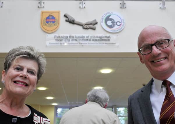 Sue Snowdon, Lord-Lieutenant of County Durham, and Malcolm Donnelly, chairman of West Hartlepool Grammar School Old Boys Association, with the sculpture above them.