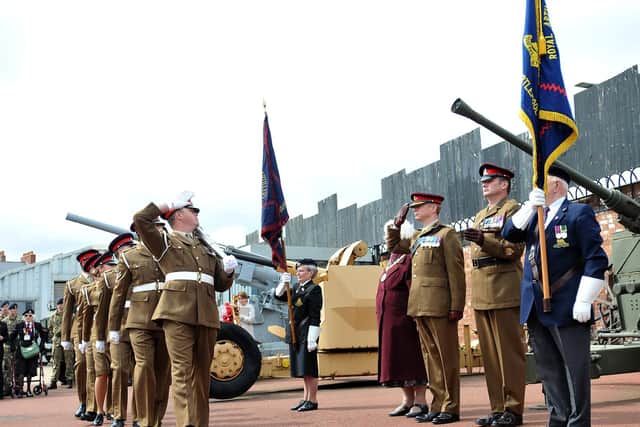 Mary Fleet taking the salute from the 5 Regiment Royal Artillery