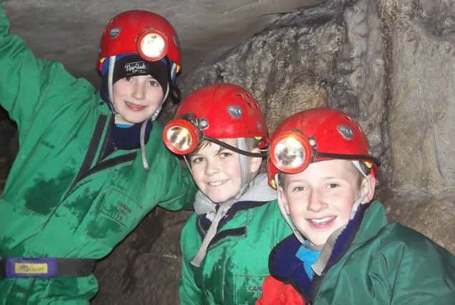 Three Clavering boys in the Long Churn cave system in the Yorkshire Dales