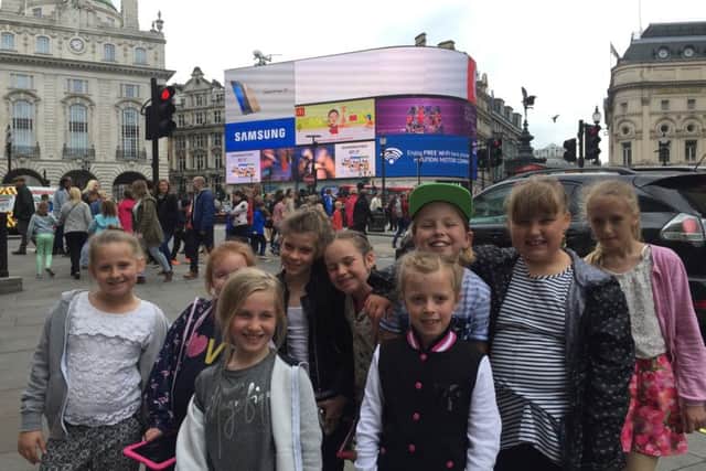 Members of the group at Picadilly Circus
