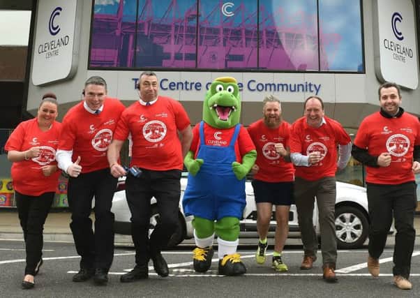 Mascot Cleveland Croc joins marathon man Ian Jolly, (third right) along with representatives of the Cleveland Centre and Everyone Active, organisers of the Ali Brownlee 5k (from left) Chantel Swales, Garry Jackson, Robert Coates, Scott Hydon and Mark IAnson.