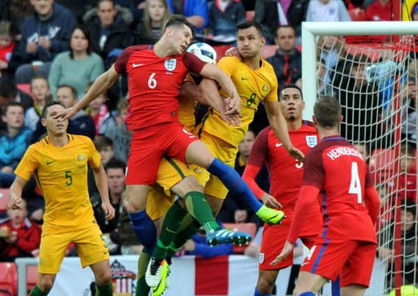 England defender John Stones battle for the ball in last night's friendly against Australia. Picture by Frank Reid