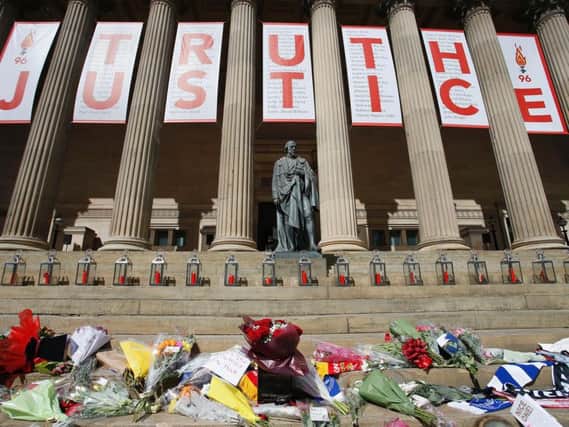 A giant banner at St George's Hall in Liverpool, with a candle lit for each of the 96 Liverpool fans who died as a result of the Hillsborough disaster.