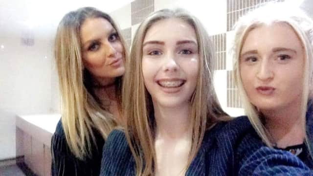 Perrie posing for selfies at a Hartlepool social club with fans Chloe Nicole and Brooke Gorman