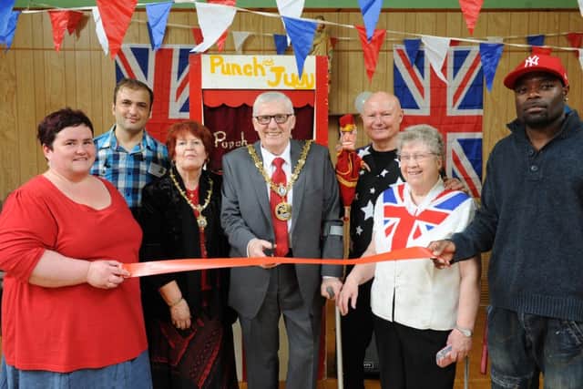 Asylum group volunteer Mary Barrett is joined by the Mayor Coun Rob Cook and Mayoress Brenda Cook at the groups Everything British Party held at St Josephs Church Hall.