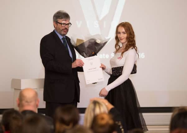Hayley receives her her Student of the Year award from CCAD Principal, Martin Raby.