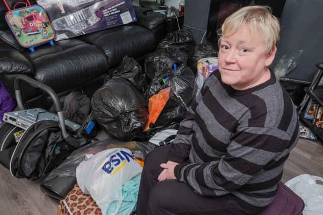 Lesley Hornsby with some of the donations she took to flood victims in Yorkshire.