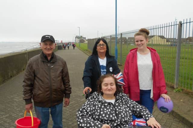 Emm Pennick guided by sister Julie with carer Charlotte Lee and dad Peter Pennick at Seaton Carew