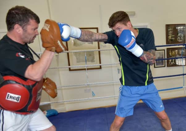 Boxer Peter Cope working out with his dad and trainer Peter. Picture by FRANK REID