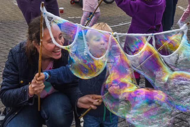 Leo Forster-Hewitson (2) with mum Claire, of Ludworth, blowing bubbles at the launch of the Naional Museum of the Royal Navy at Hartlepool, on Saturday.