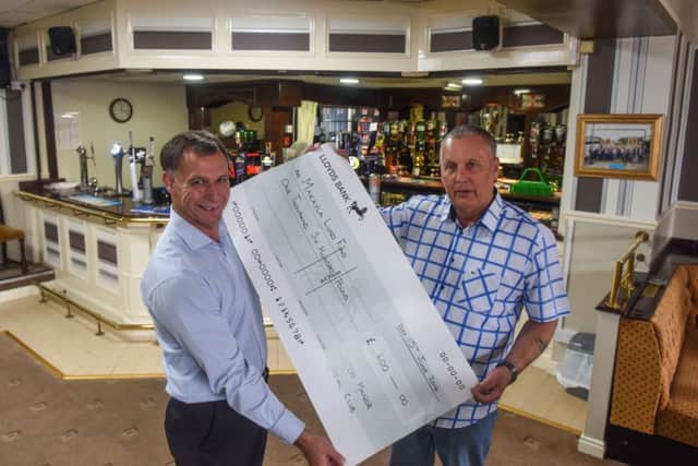 Paul Wanley (left) and Bob Bulmer of the Owton Manor Social Club, Wynyard Road, Hartlepool, with a cheque for Â£1600 for the family of Makayla Lund, who was involved in a car crash in France in which her partner and two of her children were killed.