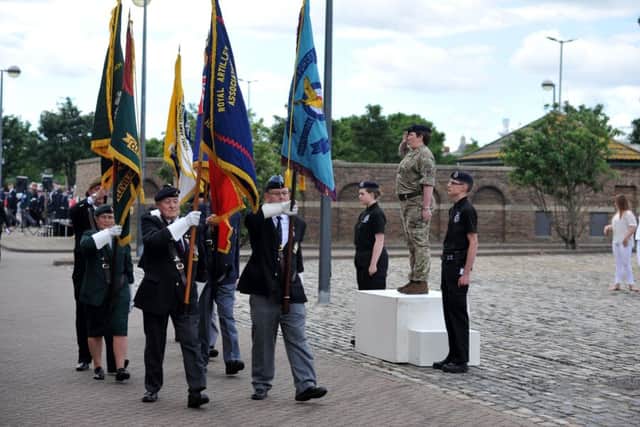 Major Dee Herraghty takes the salute at the Armed Forces Day Service last year.