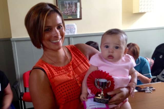 Mum Natalie Downes with daughter Nancy Coulson, overall winner of Greatham Feast Baby Show