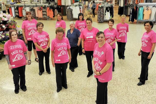 Selina Wilson (front right) with fellow Tesco staff who are taking part in the 206 Race For Life.