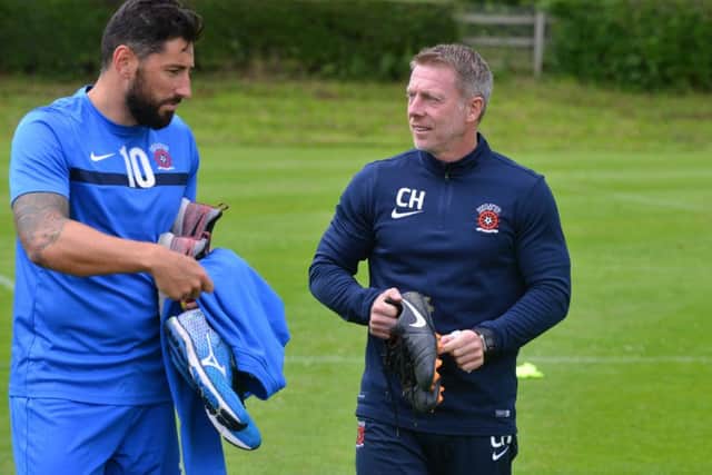 Billy Paynter chats with manager Craig Hignett