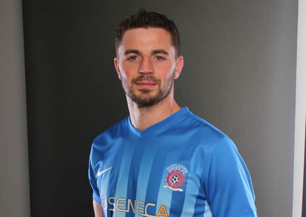 Padraig Amond models the new Pools home kit. Picture courtesy of