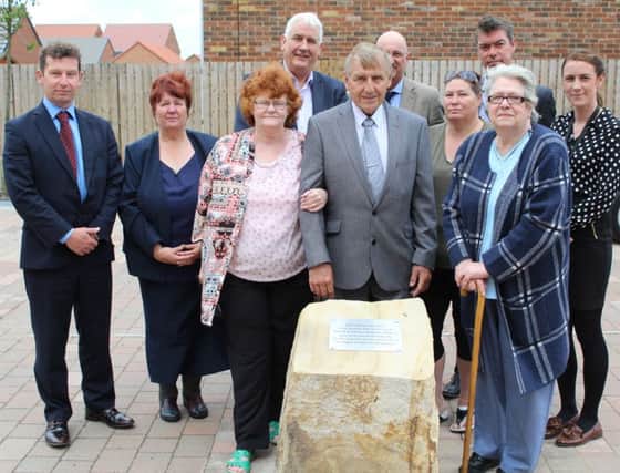 Victor Tumilty, brother of Muriel Boreland, his wife Sheila, Irene Nelson, Morris wife, and their daughter Janette Cooper at the memorial stone with (back row) representatives of Hartlepool Council, Housing Hartlepool and Taylor Wimpey North-East.
