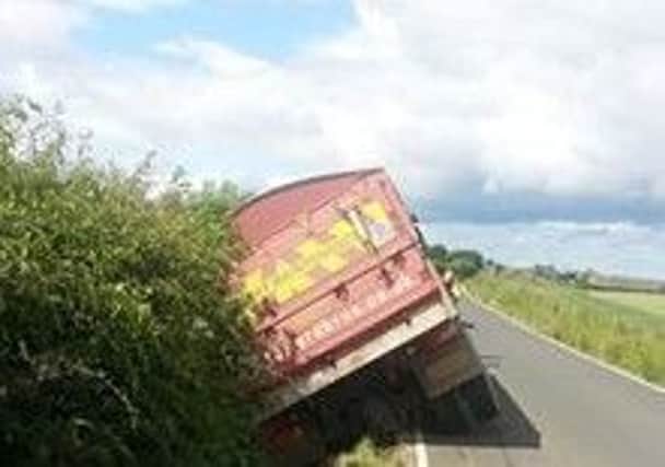 Road closed while work to remove the truck is carried out