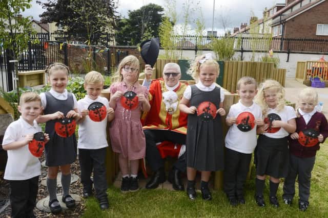 Hartlepool Mayor, councillor Rob Cook, with pupils in the improved outdoor area at St Cuthbert's Primary School.
Picture by Jane Coltman