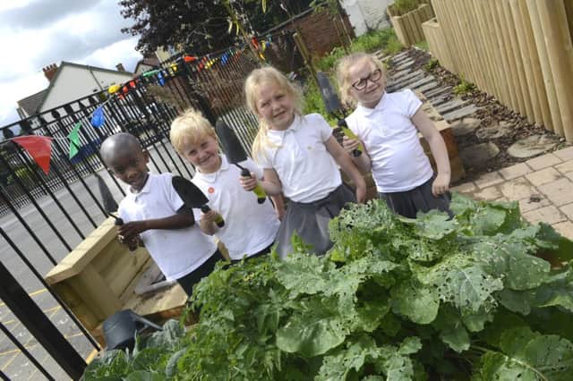 Green fingers! Pupils enjoying the improved outdoor area at St Cuthbert's Primary School in Hartlepool.
Picture by Jane Coltman