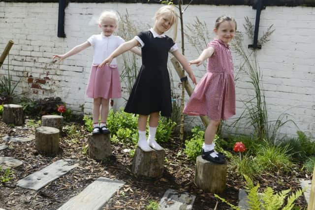 Balancing on the stepping stones - pupils enjoying the improved outdoor area at St Cuthbert's Primary School in Hartlepool.
Picture by Jane Coltman