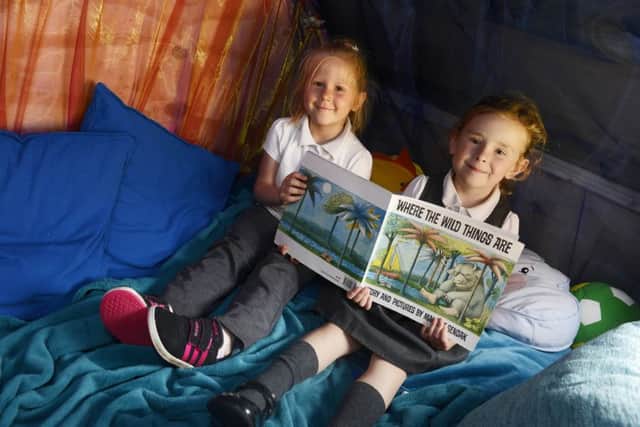 Enjoying a read in the Hobbit Hole at St Cuthbert's Primary School in Hartlepool.
Picture by Jane Coltman