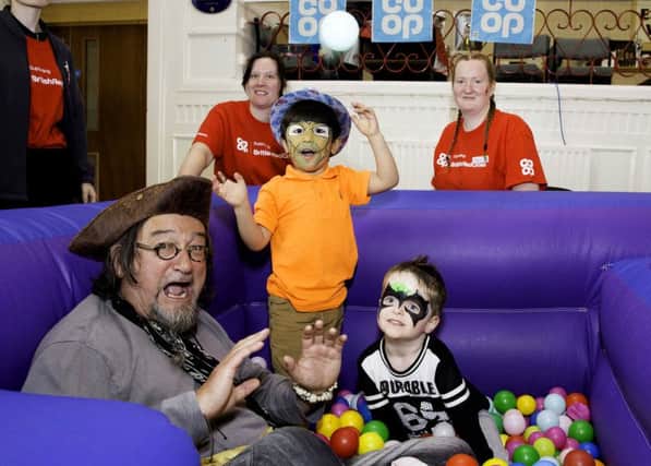 At the Co-op charity fun day are, from left, Captain Raggedy Beard, store manager Victoria Wright, four-year-old Khan Ahmadi, Co-op community pioneer Gemma Robinson, and four-year-old Charley Robinson. Pic: John Millard/UNP.