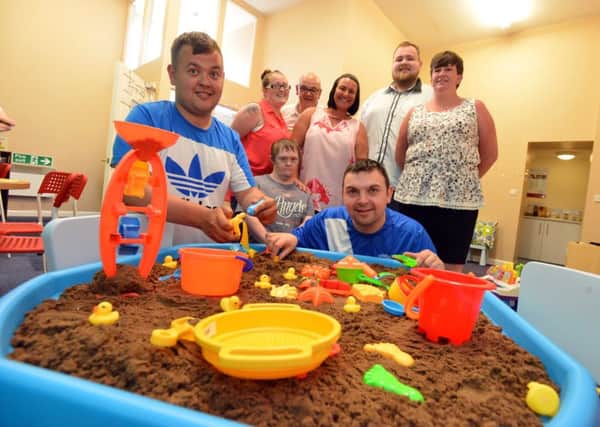 Pathways to Independence new messy play.
Front from left, group users John Redman, Ben Gingil and Steven Oliver