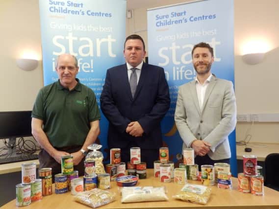 Pictured with a typical food parcel, from left to right, are Clive Hall of Hartlepool Foodbank, Coun Alan Clark and Steven Carter, the councils health improvement practitioner.