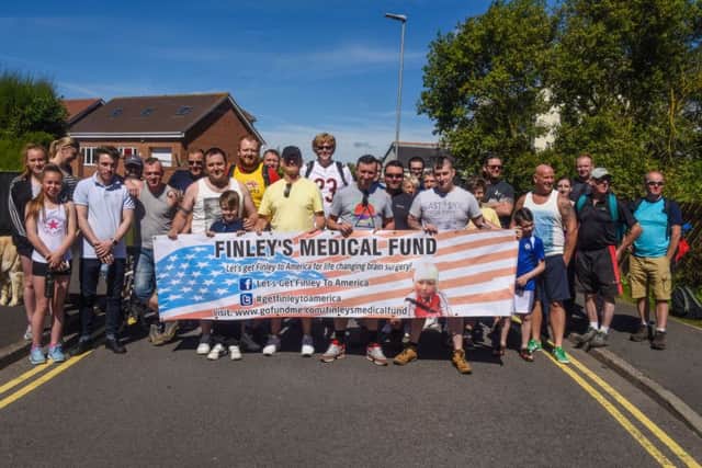 Walkers setting off on a 10-mile walk from Ocean Road, Hartlepool, on Saturday in aid of Finley's Medical Fund.