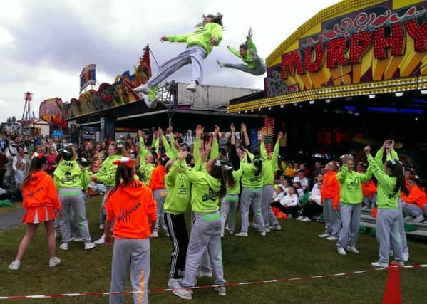The Hartlepool Hawks cheerleading academy perform during the opening of Murphy's funfair for Hartlepool Carnival
