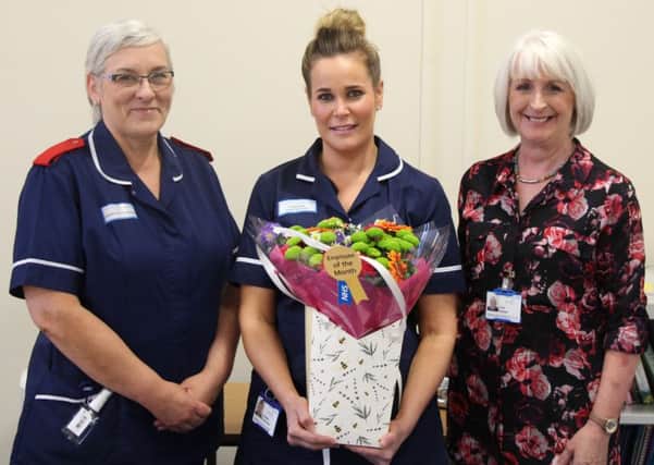 Award-winning community nurse Lyndsey Brownless (centre) with Linda Fairhall (left) and Julie Parkes (right).