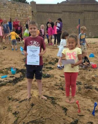 Hartlepool carnival sandcastle competition. 4-8 second place winners Liam and Jessica with a pyramid design