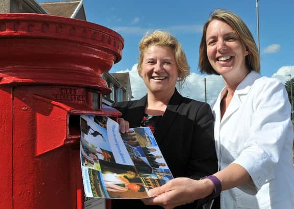 From left, Lesley Welsh (from Manor Academy) and Linda Ward (from English Martyrs School) send out one of the first photo competition postcards to their Year 7 and 8.