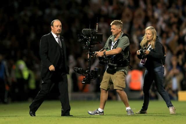 Newcastle United manager Rafael Benitez leaves the pitch dejected after the final whistle at Craven Cottage